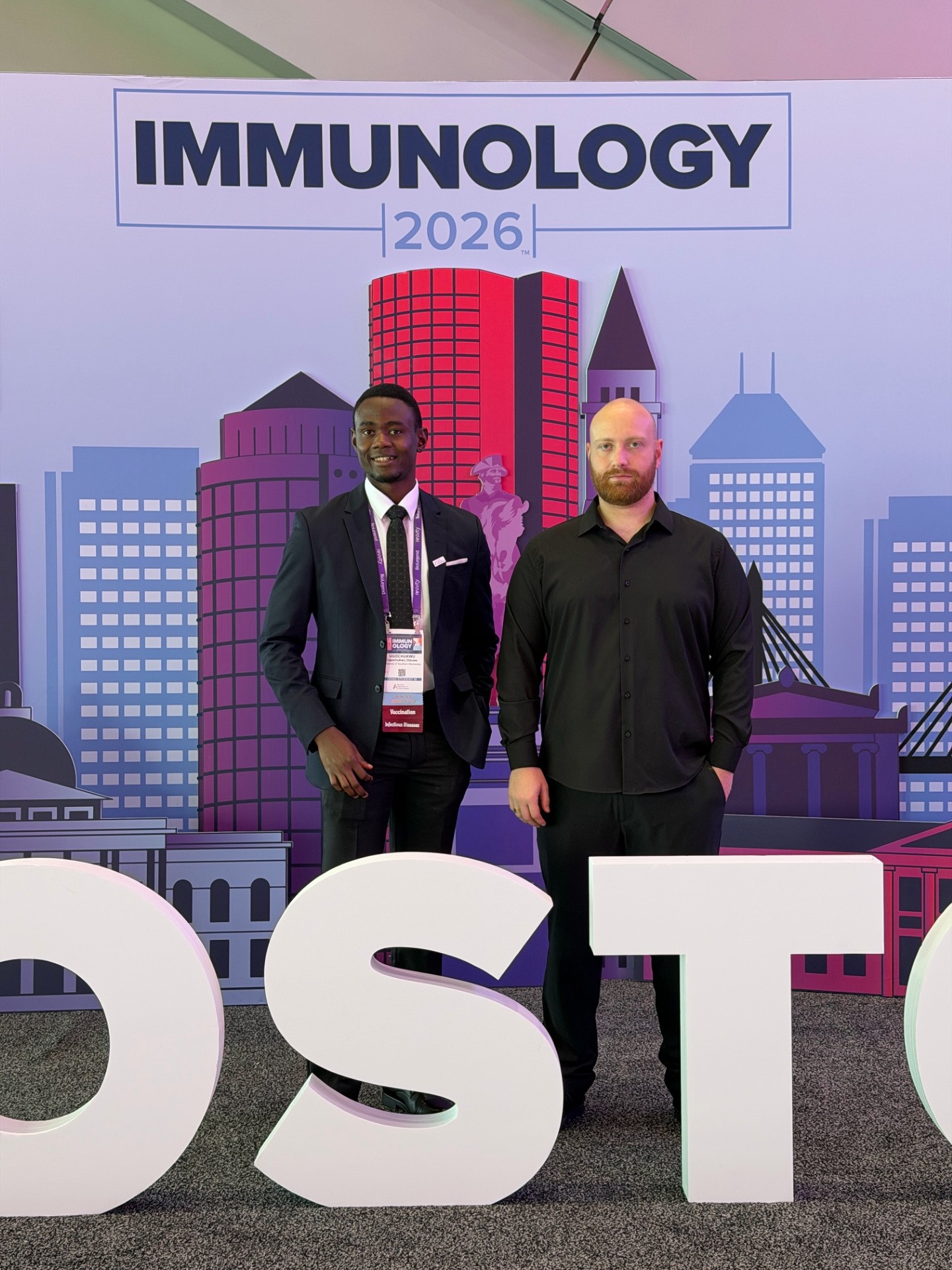 Ugochukwu Oduwe and Giorgi Kenkebashvili at AAI Immunology 2026, Boston